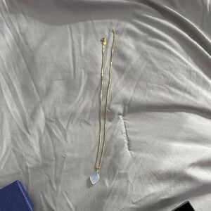 Elegant Gold Necklace with Blue and White Pendant